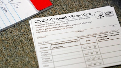 A COVID-19 vaccination record card at Seton Medical Center in Daly City, Calif., Dec. 24, 2020.