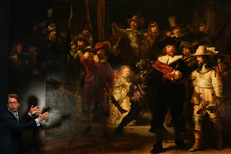 Museum director Taco Dibbits in front of Rembrandt's 'Night Watch,' Amsterdam, June 23, 2021.