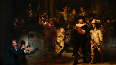 Museum director Taco Dibbits in front of Rembrandt's 'Night Watch,' Amsterdam, June 23, 2021.