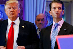Then-President-elect Donald Trump, CFO Allen Weisselberg, center, and Donald Trump Jr., right, at a news conference in the lobby of Trump Tower, New York, Jan. 11, 2017.