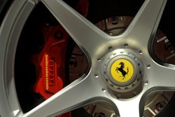 In this Wednesday, May 8, 2013 file photo a Ferrari logo is displayed on a wheel in the department Ferrari factory in Maranello, Italy. Luxury sports carmaker Ferrari has tapped Benedetto Vigna, an Italian executive at Europe’s largest semiconductor chipmaker, as its new CEO, the company announced Wednesday, June 9, 2021.