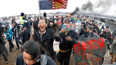 Dakota Access Pipeline protesters march out of the Oceti Sakowin camp near Cannon Ball, N.D., Feb. 22, 2017.