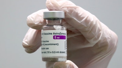 In this file photo, medical staff prepares an AstraZeneca coronavirus vaccine.
