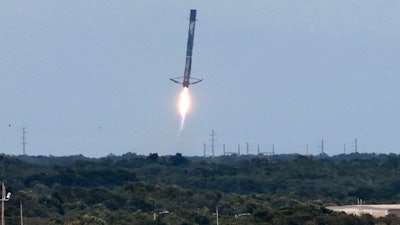 A SpaceX Falcon 9 reusable booster comes in for an on-land touchdown at Cape Canaveral Space Force Station, Fla., June 30, 2021.