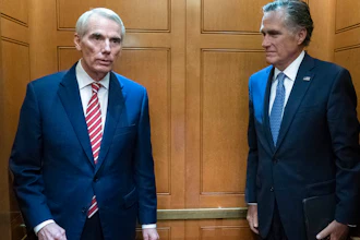 Sen. Rob Portman, R-Ohio, left, and Sen. Mitt Romney, R-Utah, leave in the elevator after a closed door talks about infrastructure on Capitol Hill, July 15, 2021.