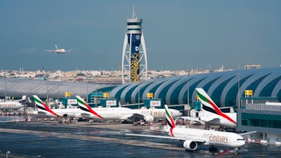 An Emirates jetliner comes in for landing at Dubai International Airport, Dec. 11, 2019.