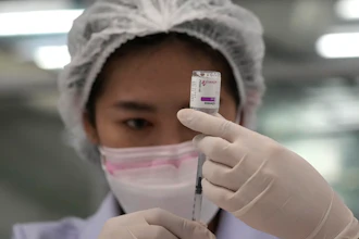A health worker prepares a shot of the AstraZeneca COVID-19 vaccine at the Central Vaccination Center in Bangkok, July 22, 2021.