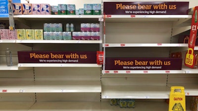 Empty shelves and signs in the soft drinks aisle of a Sainsbury's store in Rowley Regis, England, July 22, 2021.