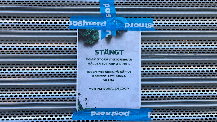 A sign on a Coop supermarket indicates that the store is closed due to 'IT disturbances,' Vastberga, Sweden, July 3, 2021.