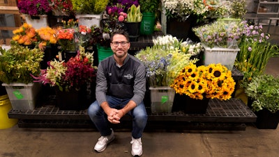 Steven Dyme, owner of Flowers for Dreams, poses for a portrait at his warehouse, July 23, 2021, Chicago.