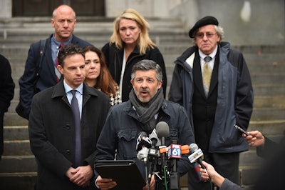 Ian Hockley, father of Dylan Hockley, one of the children killed in the 2012 Sandy Hook shooting, addresses the media after a hearing before the state Supreme Court in Hartford, Conn., Nov. 14, 2017.