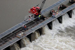 Workers open bays of the Bonnet Carre Spillway to divert rising water from the Mississippi River to Lake Pontchartrain, Norco, La., May 10, 2019.
