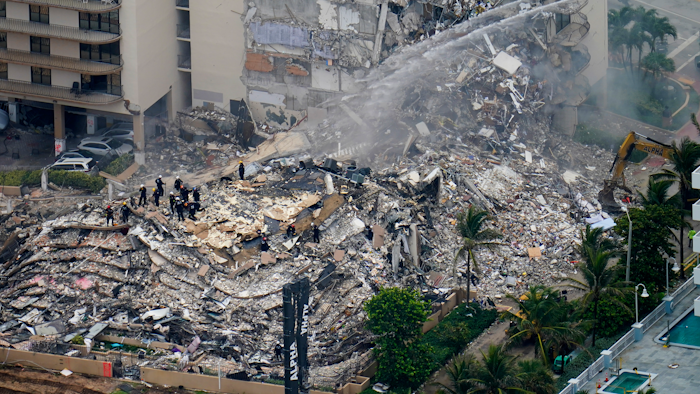 Rescue workers work in the rubble at the Champlain Towers South Condo in Surfside, Fla., in this Friday, June 25, 2021, file photo.
