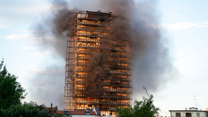 Smoke billows from a building in Milan, Italy, Aug. 29, 2021.