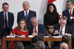 Deputy Prime Minister of Canada Chrystia Freeland, left, Mexico's top trade negotiator Jesus Seade, center, and U.S. Trade Representative Robert Lighthizer, sign an update to the North American Free Trade Agreement,at the national palace in Mexico City, Dec. 10. 2019.