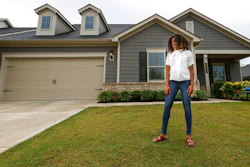 Crystal Marie McDaniels poses in front of her home in Charlotte, N.C., July 9, 2021.
