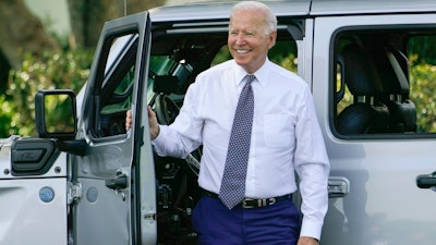 President Joe Biden smiles after driving a Jeep Wrangler 4xe Rubicon on the South Lawn of the White House, Aug. 5, 2021.