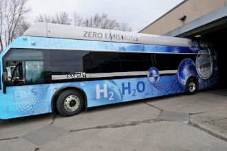 Kevin Baker, a maintenance technician, drives a hydrogen fuel cell bus out of the terminal in Canton, Ohio, March 16, 2021.