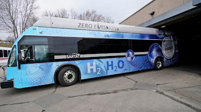 Kevin Baker, a maintenance technician, drives a hydrogen fuel cell bus out of the terminal in Canton, Ohio, March 16, 2021.