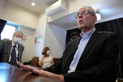 Former Nissan Motor Co. executive Greg Kelly, right, accompanied by his wife Dee Kelly and his lawyer Yoichi Kitamura, during an interview with the Associated Press in Tokyo, Aug. 18, 2021.