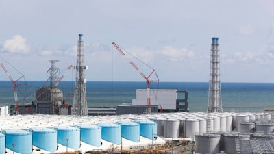 The nuclear reactor units of No. 3, left, and 4 at the Fukushima Daiichi nuclear power plant, Okuma town, Japan, Feb. 27, 2021.
