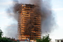 Smoke billows from a building in Milan, Italy, Aug. 29, 2021.