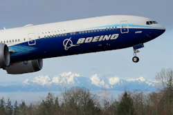 In this file photo, a Boeing 777X airplane takes off on its first flight.