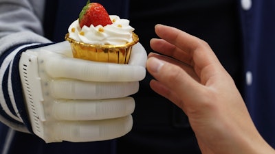 An MIT-developed inflatable robotic hand gives amputees real-time tactile control.