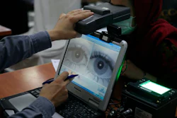 Before falling to the Taliban, the Afghan government made extensive use of biometric security, including scanning the irises of people like this woman who applied for passports.