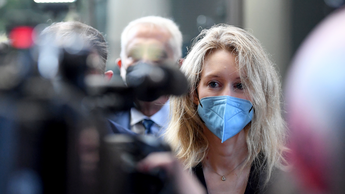 Elizabeth Holmes, founder and CEO of Theranos, arrives at the federal courthouse for jury selection in her trial, San Jose, Calif., Aug. 31, 2021.