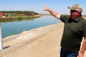 Kevin Spesert, public affairs and real estate manager for the Sites Project Authority, at the main canal of the Glenn Colusa Irrigation District near Sites, Calif., July 23, 2021.
