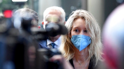 Elizabeth Holmes, founder and CEO of Theranos, arrives at for jury selection in her trial, San Jose, Calif., Aug. 31, 2021.