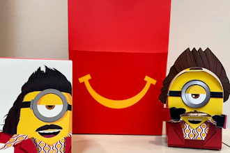 A cardboard McDonald’s Happy Meal toy is shown with a Happy Meal box, Sept. 20, 2021.