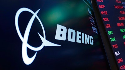 Boeing logo on a screen above a trading post on the floor of the New York Stock Exchange, July 13, 2021.