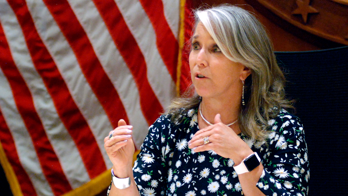 In this July 29, 2021, file photo New Mexico Gov. Michelle Lujan Grisham speaks at a news conference in Santa Fe, N.M. Grisham is returning to the podium next week at an annual gathering of oil executives. She's also contemplating attendance at the U.N. Climate Conference in Scotland in November, internal emails show.