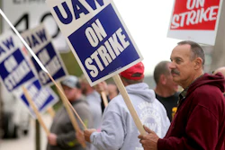 John Deere Dubuque Works union employee Steve Thor pickets outside UAW Local 94 in Dubuque, Iowa, Oct. 14, 2021.