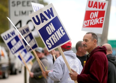John Deere Dubuque Works union employee Steve Thor pickets outside UAW Local 94 in Dubuque, Iowa, Oct. 14, 2021.