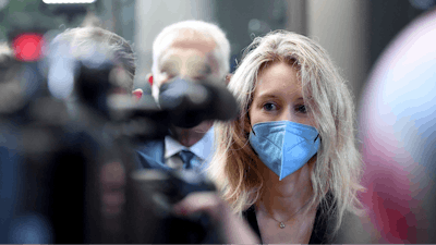 Elizabeth Holmes, founder and CEO of Theranos, arrives at the federal courthouse for jury selection in her trial, San Jose, Calif., Aug. 31, 2021.