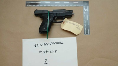 Evidence photo of an M11 semiautomatic handgun, Nov. 15, 2015, Suffolk, Mass.