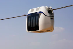 A small, four-seat pod made by uSky glides above a test track in Sharjah, United Arab Emirates, Oct. 28, 2021.