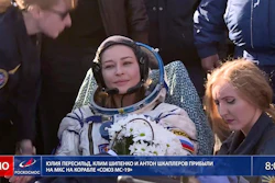 In this photo taken from video footage released by Roscosmos Space Agency, actress Yulia Peresild sits in a chair shortly after the landing of the Russian Soyuz MS-18 space capsule, southeast of the Kazakh town of Zhezkazgan, Kazakhstan, Sunday, Oct. 17, 2021.