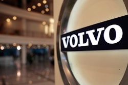 This Feb. 6, 2020, file photo shows the Volvo logo in the lobby of the Volvo corporate headquarters in Brussels. Swedish automaker Volvo said Monday, Oct. 4,2021 it plans to raise at least 25 billion kroner ($2.9 billion) by selling shares to fund its electric vehicle transformation strategy. Volvo and its parent company, Chinese carmaker Geely, have applied to hold an initial public offering on the Nasdaq Stockholm.