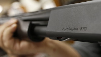 Remington name etched on a model 870 shotgun at Duke's Sport Shop, New Castle, Pa., March 1, 2018.