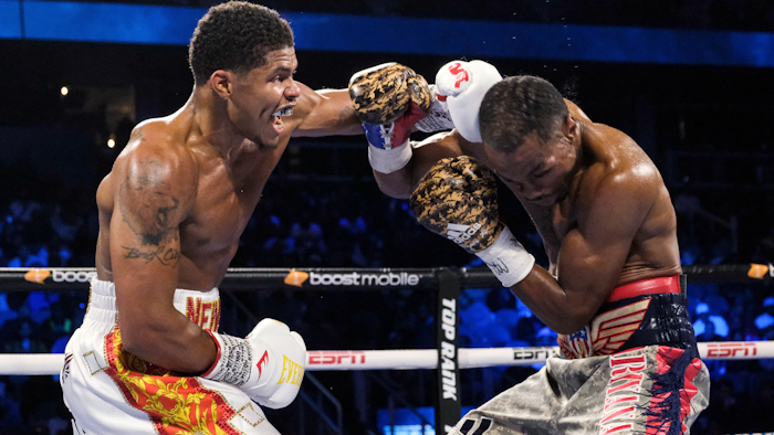 Shakur Stevenson, left, lands a punch on Jamel Herring during a junior lightweight boxing bout in Atlanta, Oct. 24, 2021.