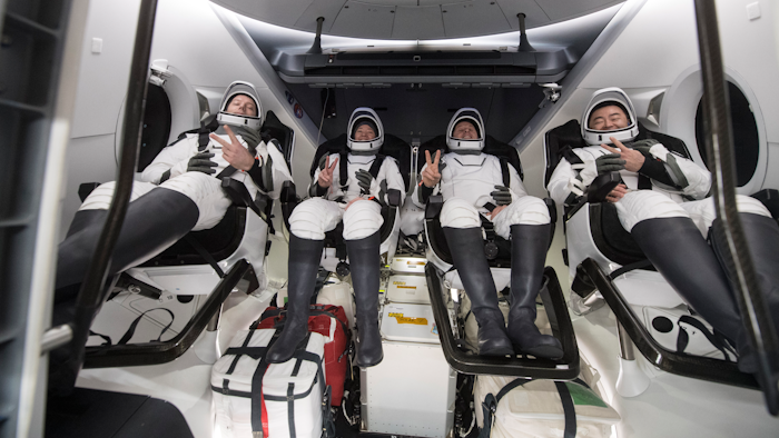 From left to right, European Space Agency astronaut Thomas Pesquet, NASA astronauts Megan McArthur and Shane Kimbrough, and Japan Aerospace Exploration Agency astronaut Akihiko Hoshide inside the SpaceX Dragon spacecraft off the coast of Pensacola, Fla., Nov. 8, 2021.