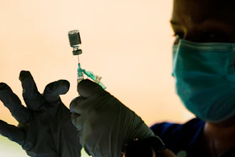 A syringe is prepared with the Pfizer COVID-19 vaccine at a clinic at Reading Area Community College, Reading, Pa., Sept. 14, 2021.