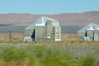 The decommissioned plutonium-producing DR reactor, left, and D reactor, right, on the Hanford Nuclear Reservation near Richland, Wash., June 13, 2017.
