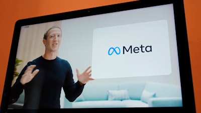 Seen on the screen of a device in Sausalito, Calif., Facebook CEO Mark Zuckerberg announces the company's new name, Meta, during a virtual event, Oct. 28, 2021.