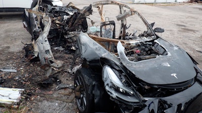 Damage to a 2021 Tesla Model 3 Long Range Dual Motor following a crash in Coral Gables, Fla., Sept. 2021.