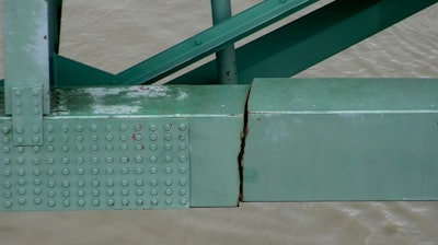 This undated photo released by the Tennessee Department of Transportation shows a crack in a steel beam on the Interstate 40 bridge, near Memphis, Tenn. The crack in a steel beam that forced the closure of the Interstate 40 bridge connecting Arkansas and Tennessee for three months likely began when the span was fabricated in the 1970s and went undetected for years, a report by Arkansas' Transportation Department released Thursday, Nov. 11, 2021, said.